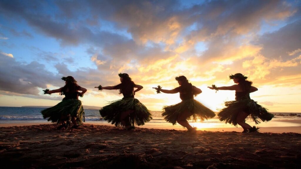Real Life Ohana - ohana meaning Silhouettes of Hawaiian hula dancers performing at sunset on the beach, celebrating Aloha spirit and island culture