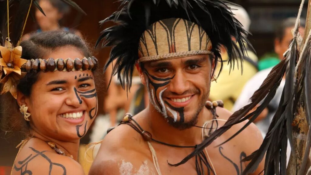 rapa nui people - easter island Rapa Nui performers wearing traditional body paint and feathered attire during a cultural festival on Easter Island.
