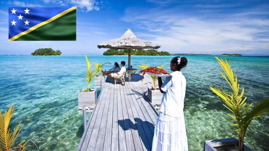 travel to solomon islands - solomon islands flag Tourists enjoying the view of clear blue waters in the Solomon Islands, with the national flag representing pride and unity.