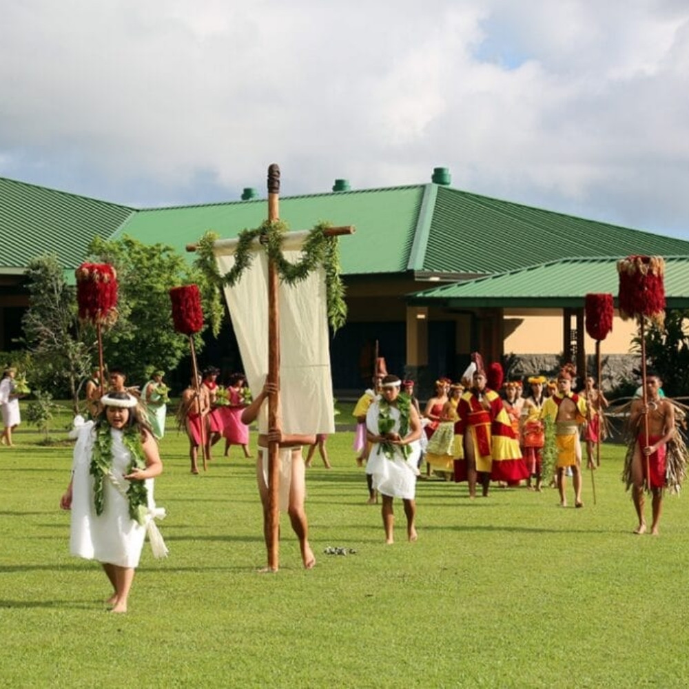Makahiki - thanksgiving Traditional Hawaiian Makahiki procession with participants in cultural attire honoring Lono, peace, harvest, and community.