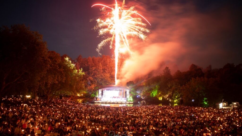 Large crowd gathered at Bowl of Brooklands in New Plymouth enjoying a Christmas show with fireworks lighting up the sky.