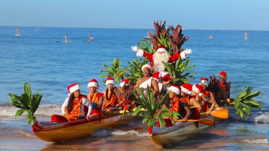 Hawaiian Santa on a outrigger canoe on the beach Hawaiian Santa on a outrigger canoe on the beach